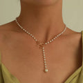 14k Gold Tassel Bow Pearl Necklace